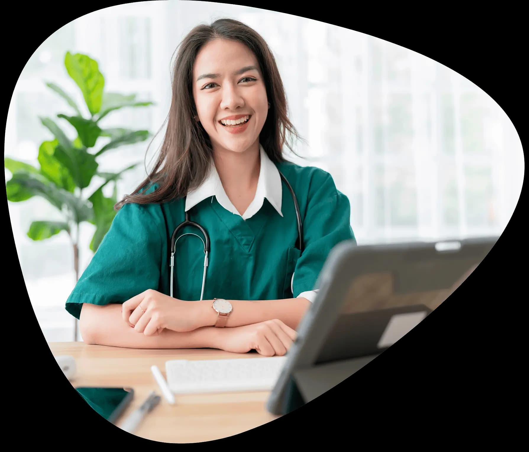 Healthcare professional smiling at a desk